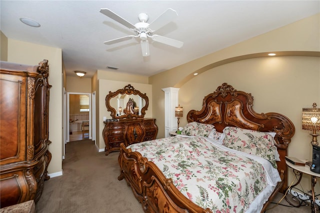 bedroom with ornate columns, ceiling fan, and carpet floors