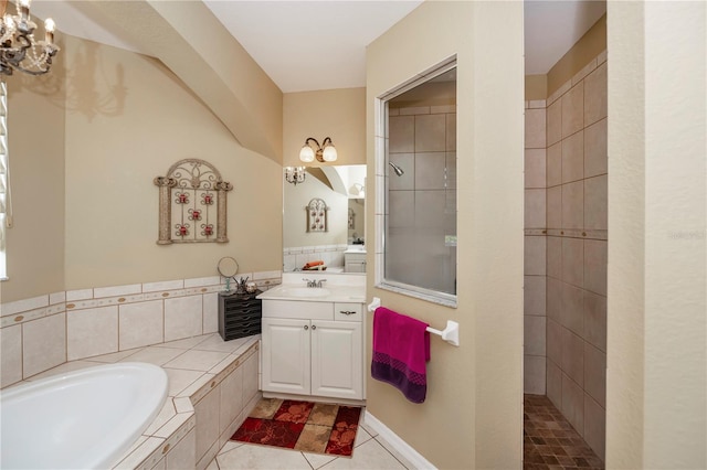 bathroom featuring vanity, plus walk in shower, and tile patterned floors