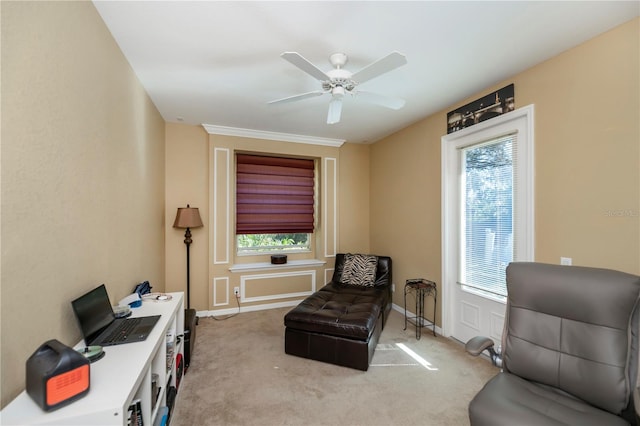 sitting room featuring light colored carpet, plenty of natural light, and ceiling fan