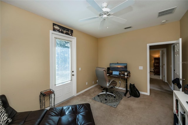 carpeted office with ceiling fan