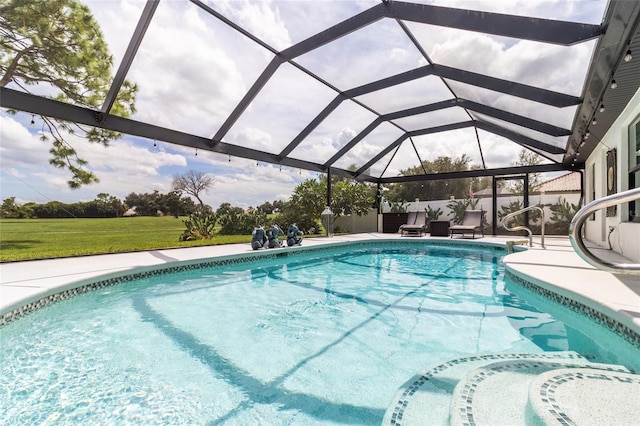 view of swimming pool featuring a lanai and a patio area