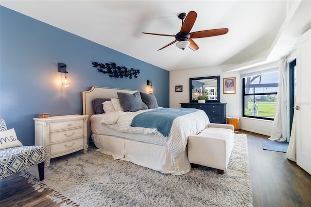 bedroom with ceiling fan and dark hardwood / wood-style floors