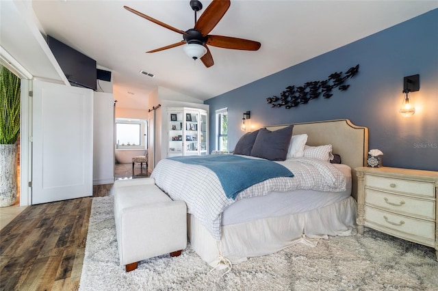 bedroom with lofted ceiling, ceiling fan, and hardwood / wood-style flooring