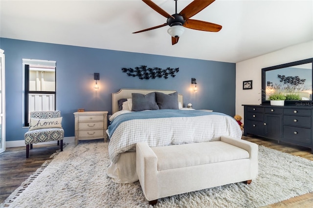 bedroom featuring ceiling fan and dark hardwood / wood-style flooring