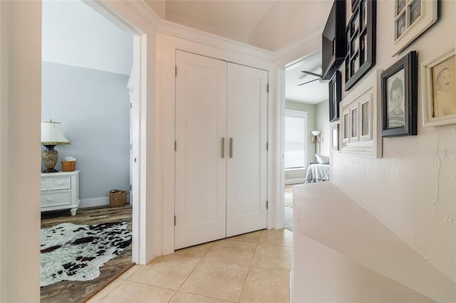 corridor with light tile patterned floors