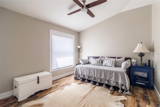 bedroom featuring lofted ceiling, dark wood-type flooring, and ceiling fan