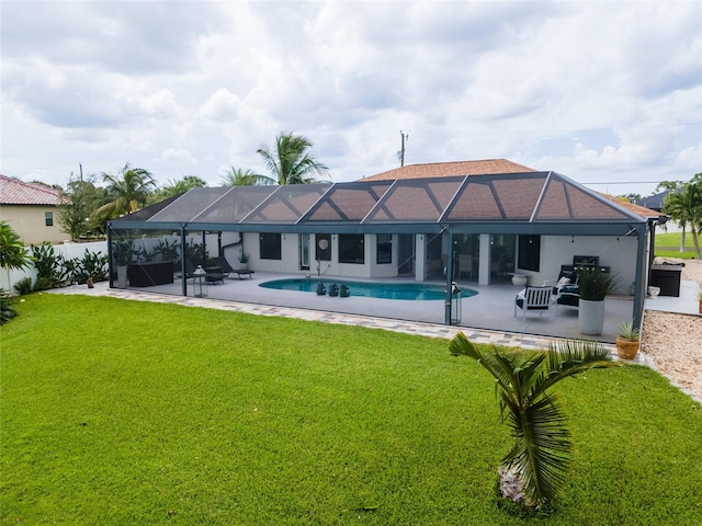 back of property featuring a lanai, a patio, an outdoor living space, and a yard