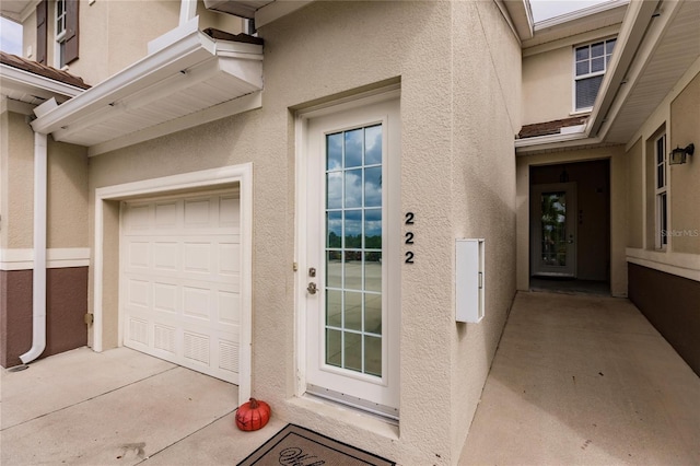 entrance to property featuring a garage