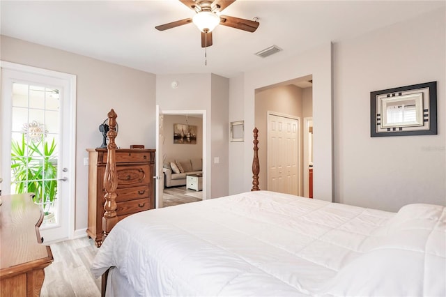 bedroom featuring hardwood / wood-style flooring and ceiling fan