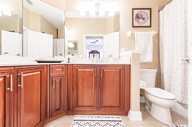 bathroom featuring tile patterned flooring, vanity, and toilet