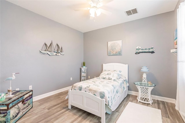 bedroom featuring ceiling fan and hardwood / wood-style flooring