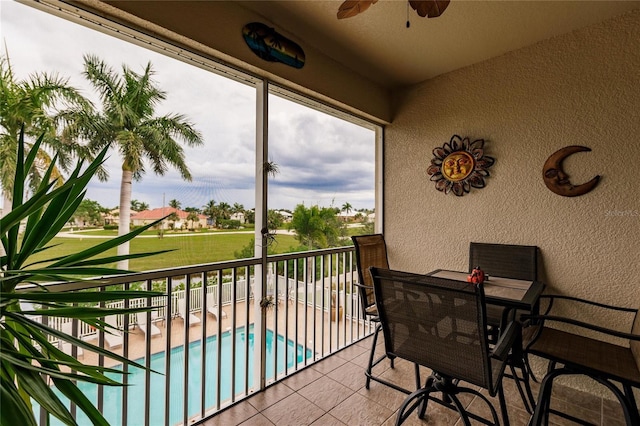 balcony featuring ceiling fan and a patio area