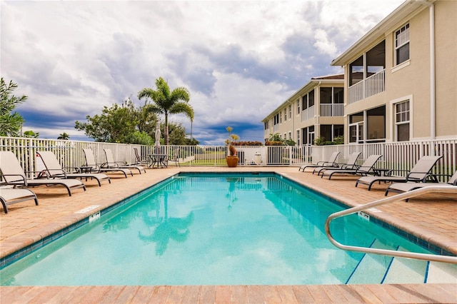 view of swimming pool featuring a patio