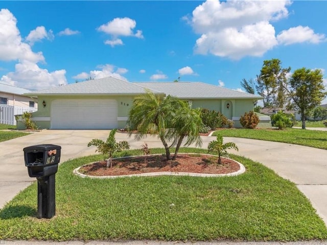 ranch-style home with a front yard and a garage