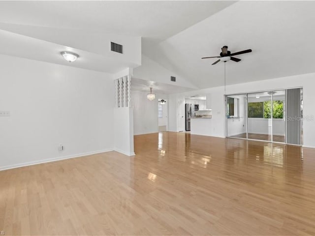 unfurnished living room with ceiling fan, high vaulted ceiling, and light hardwood / wood-style flooring