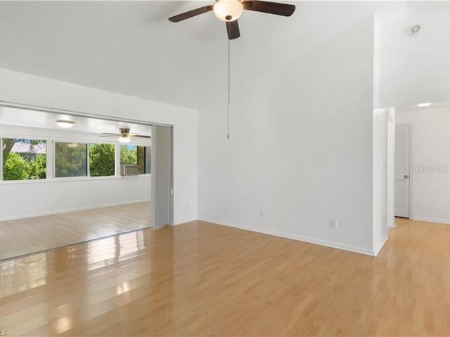 spare room with light wood-type flooring and ceiling fan