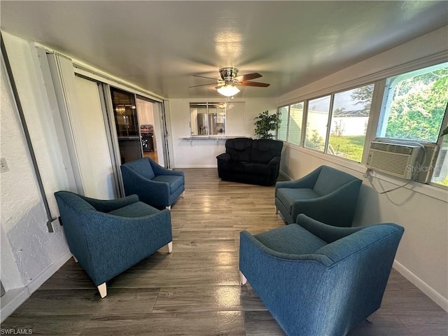 sunroom featuring ceiling fan