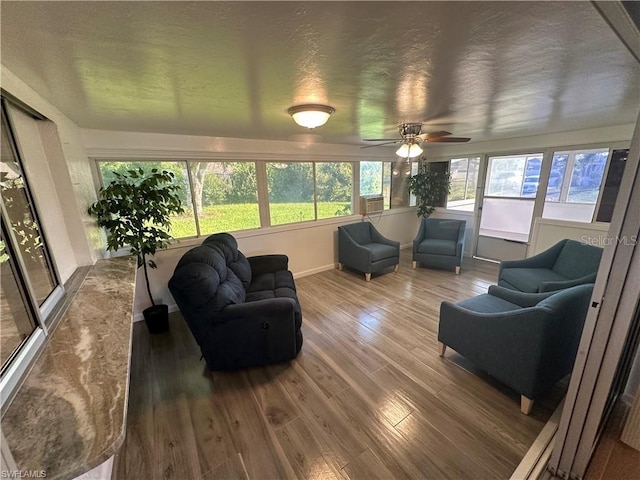 sunroom / solarium with ceiling fan