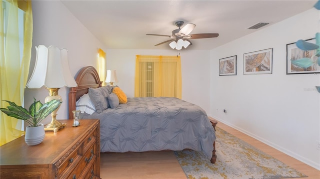 bedroom featuring ceiling fan and light hardwood / wood-style flooring