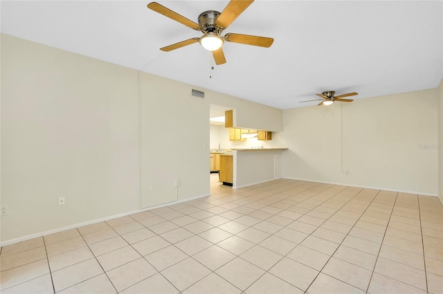 unfurnished living room with light tile patterned floors and ceiling fan