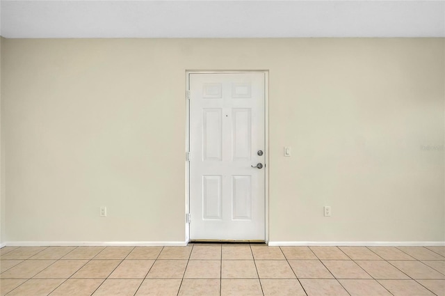 unfurnished room with light tile patterned floors