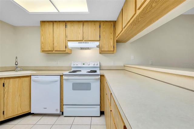 kitchen with light tile patterned floors, white appliances, and sink