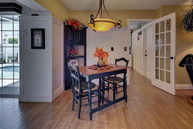 dining area with wood-type flooring