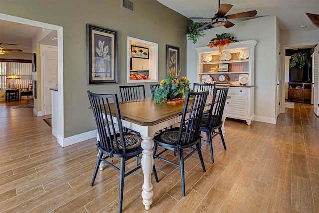 dining area featuring ceiling fan and light hardwood / wood-style flooring