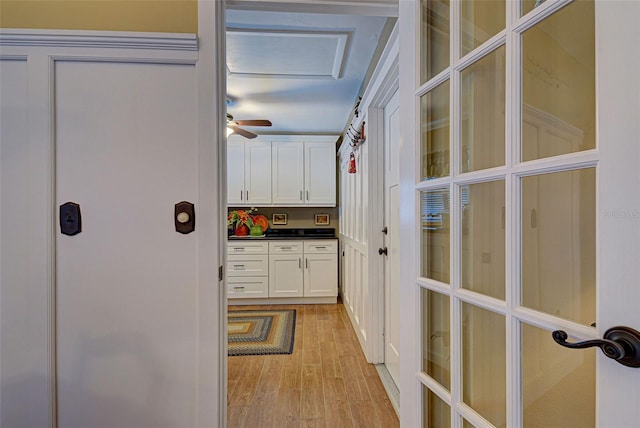 hall with light hardwood / wood-style flooring