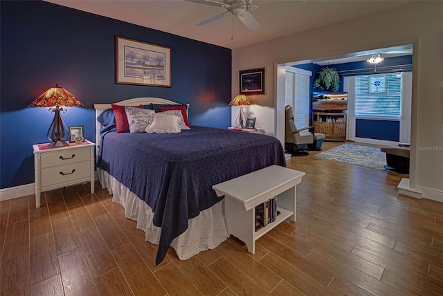 bedroom with ceiling fan and hardwood / wood-style floors