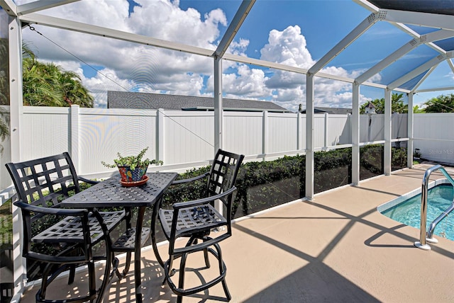 view of patio / terrace with a lanai and a fenced in pool