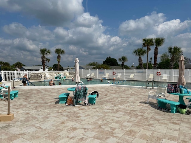 view of swimming pool with a patio