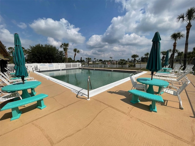 view of swimming pool with a patio