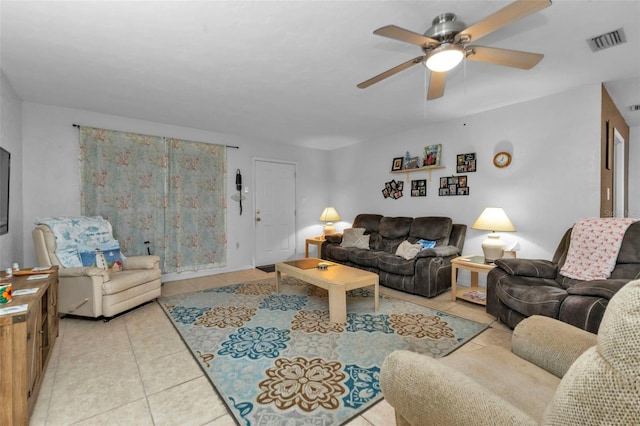 living room with ceiling fan and light tile patterned floors