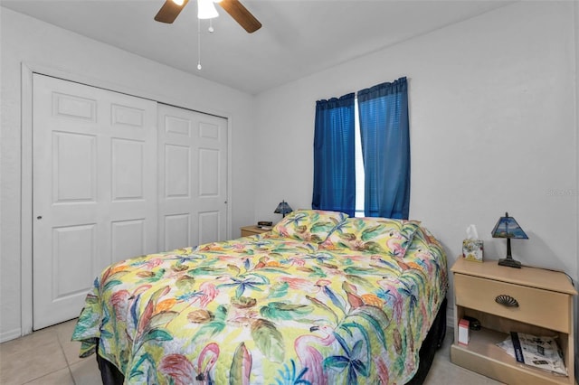 tiled bedroom featuring a closet and ceiling fan