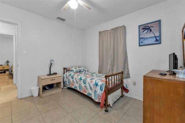 bedroom featuring light tile patterned floors and ceiling fan