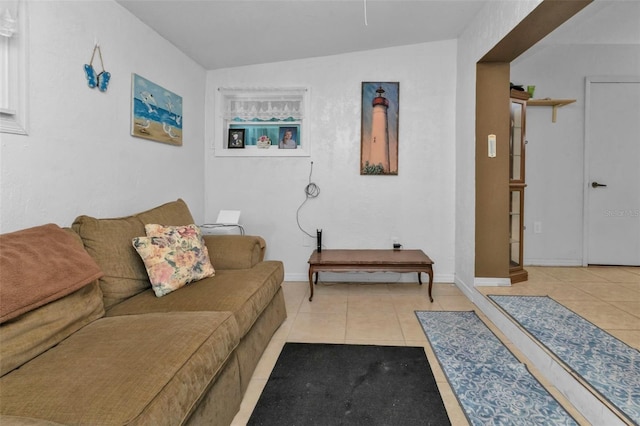 tiled living room with lofted ceiling