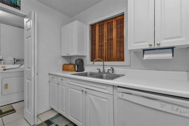 kitchen with white cabinets, dishwasher, light tile patterned floors, washer / dryer, and sink