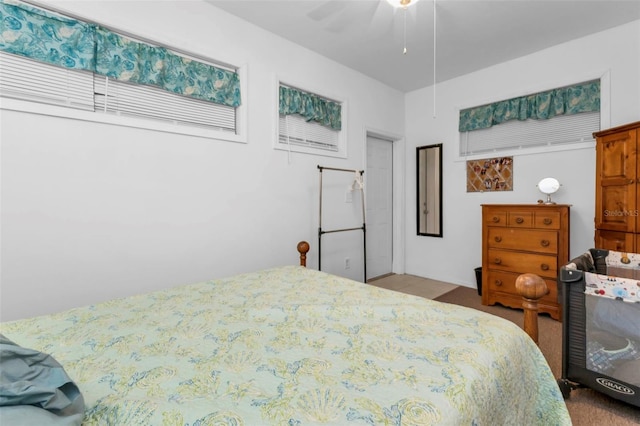 bedroom with ceiling fan and carpet