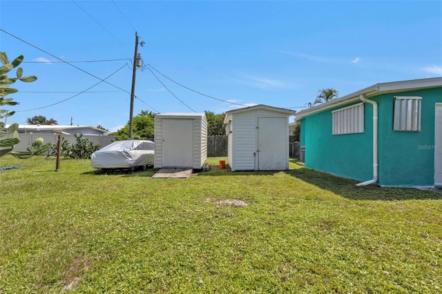 view of yard with a storage unit