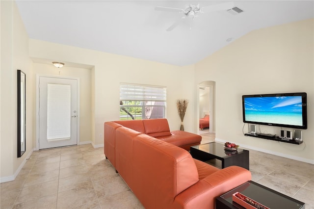 tiled living room featuring lofted ceiling and ceiling fan