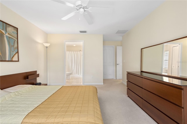 carpeted bedroom featuring ensuite bathroom and ceiling fan