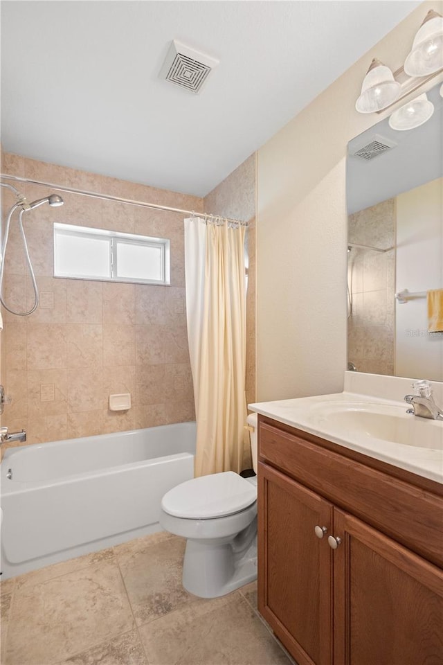 full bathroom with tile patterned flooring, shower / bath combo, vanity, and toilet