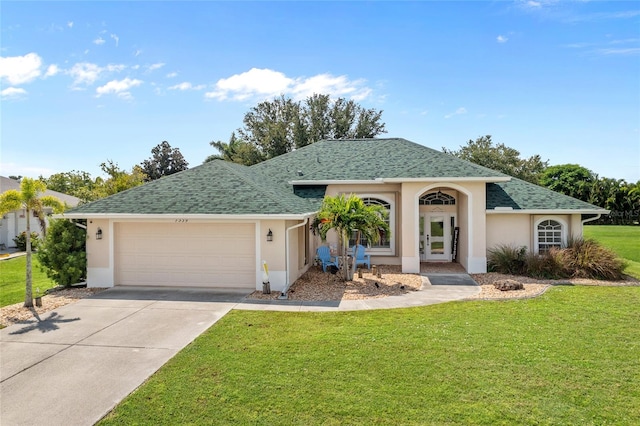 single story home featuring a front yard and a garage