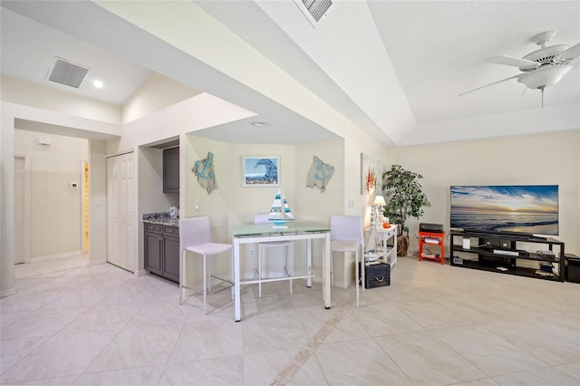 interior space with ceiling fan and lofted ceiling