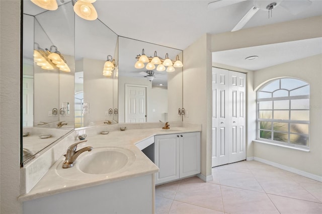 bathroom featuring ceiling fan, tile patterned flooring, and vanity