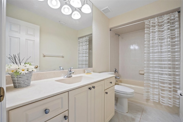 full bathroom featuring shower / bath combo with shower curtain, tile patterned floors, vanity, and toilet