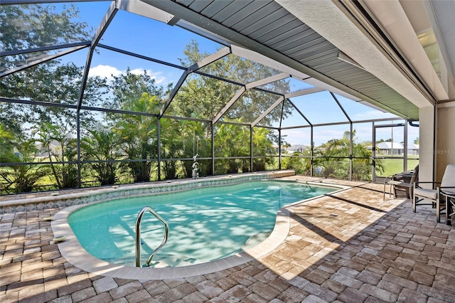 view of pool featuring a patio and a lanai