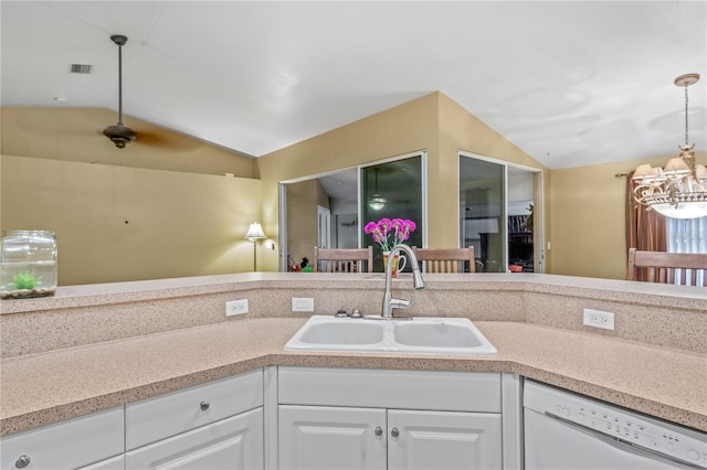 kitchen featuring white cabinets, a chandelier, vaulted ceiling, dishwasher, and sink