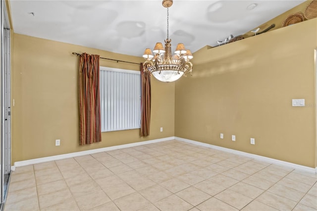 empty room with a notable chandelier